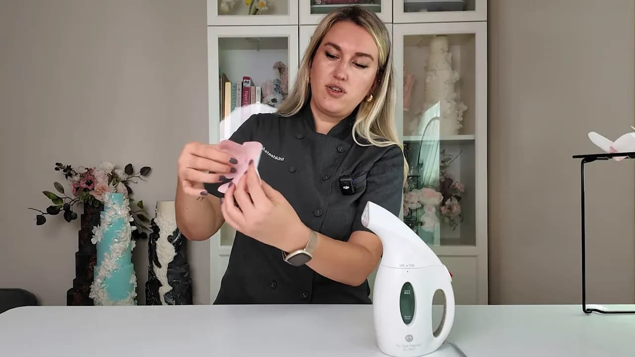 Wafer paper flower petals pinched together after steaming to form a bloom