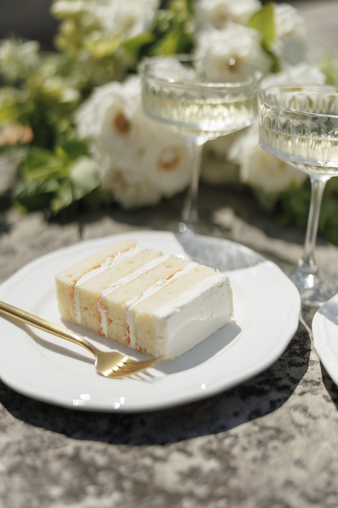Wedding cake slice photographed during a styled shoot with wedding vendors