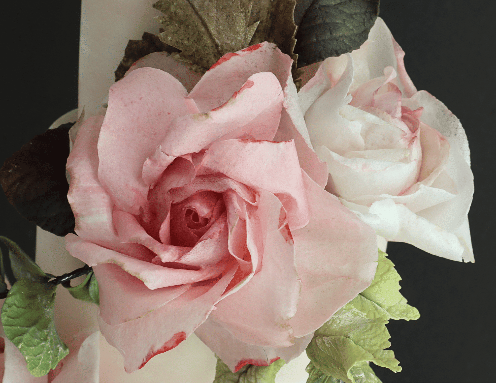 Close-up of handmade pink and white wafer paper roses
